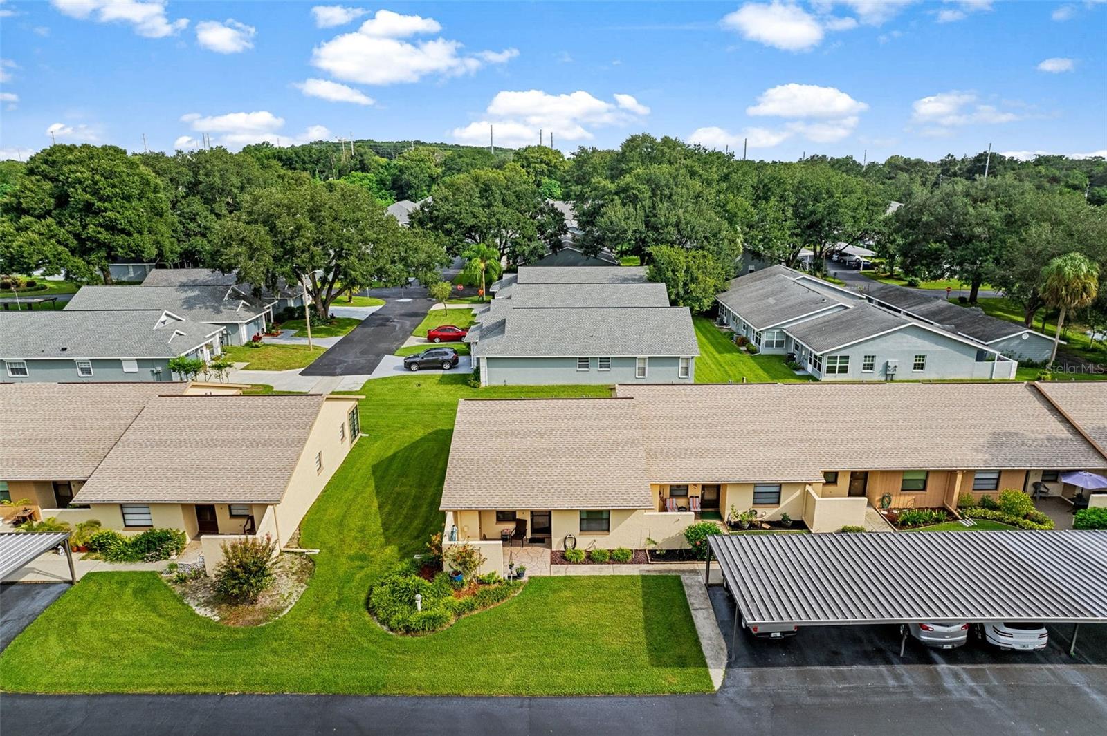 Ariel view of building and carport out front