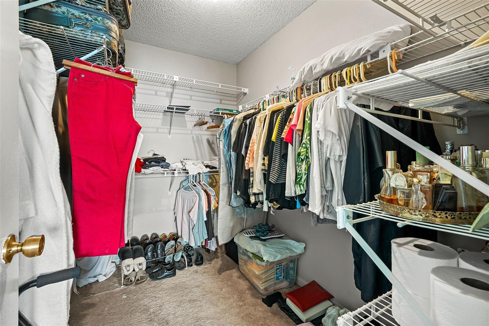 Primary bedroom walk in closet