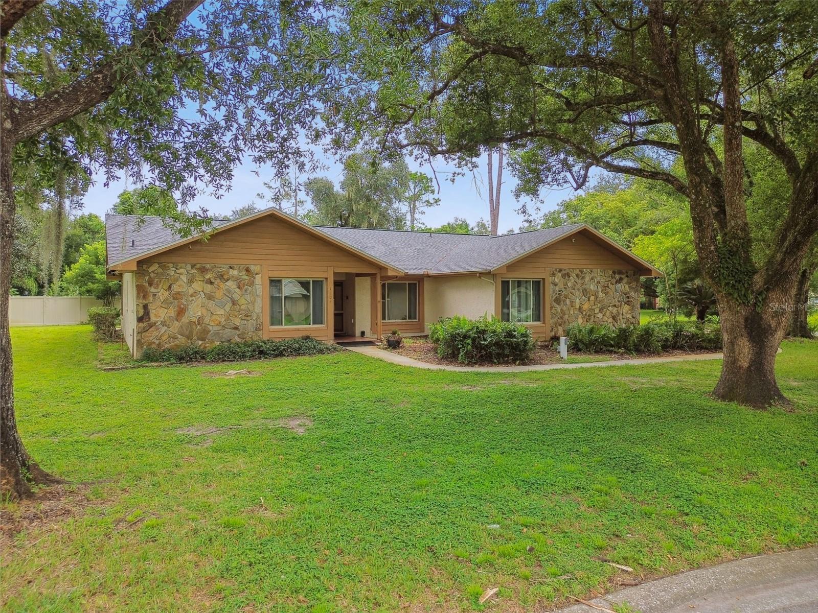 Front view of home on  large cul-de-sac lot.