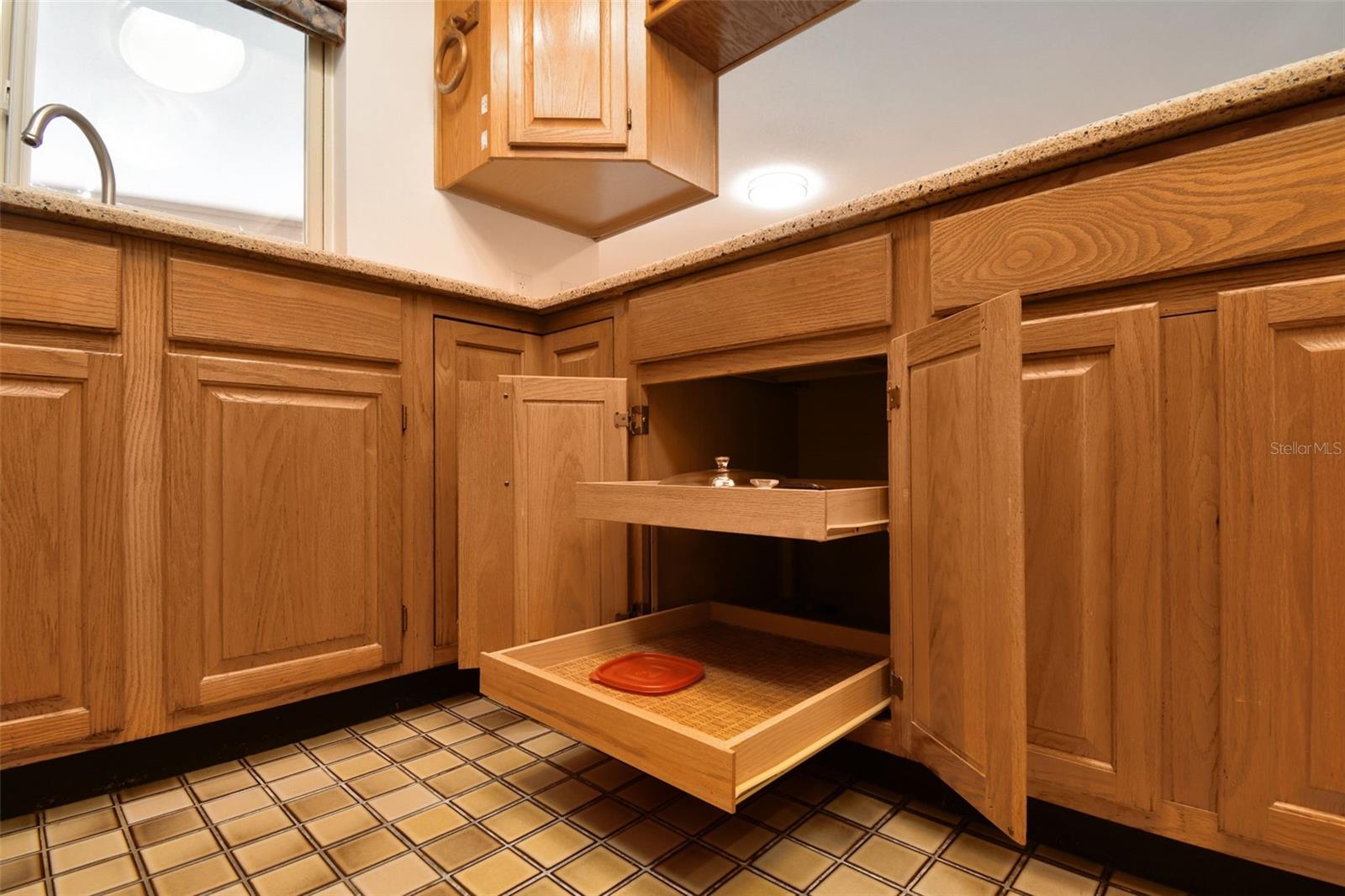 Kitchen cabinets feature pull out drawers.