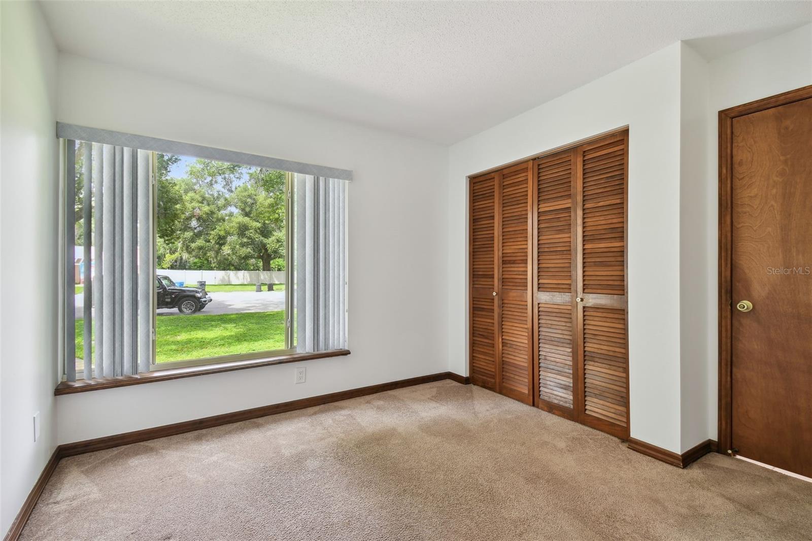 Adjoing bedroom features a large custom etched window. This bedroom could be easiy converted to suit your needs.