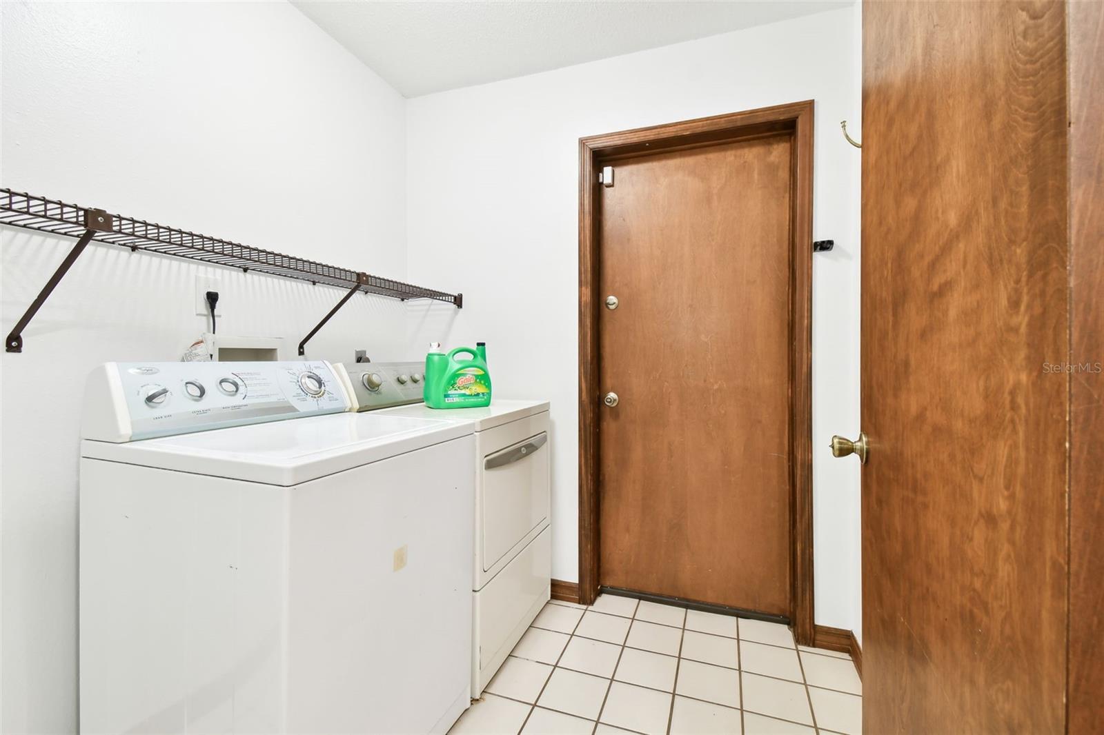 Interior laundry room with access to the garage.