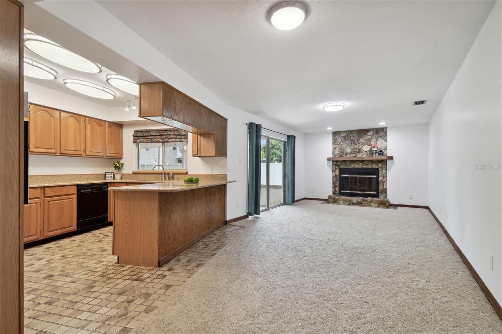 Kitchen and gathering room with views and access to outdoor entertaining.