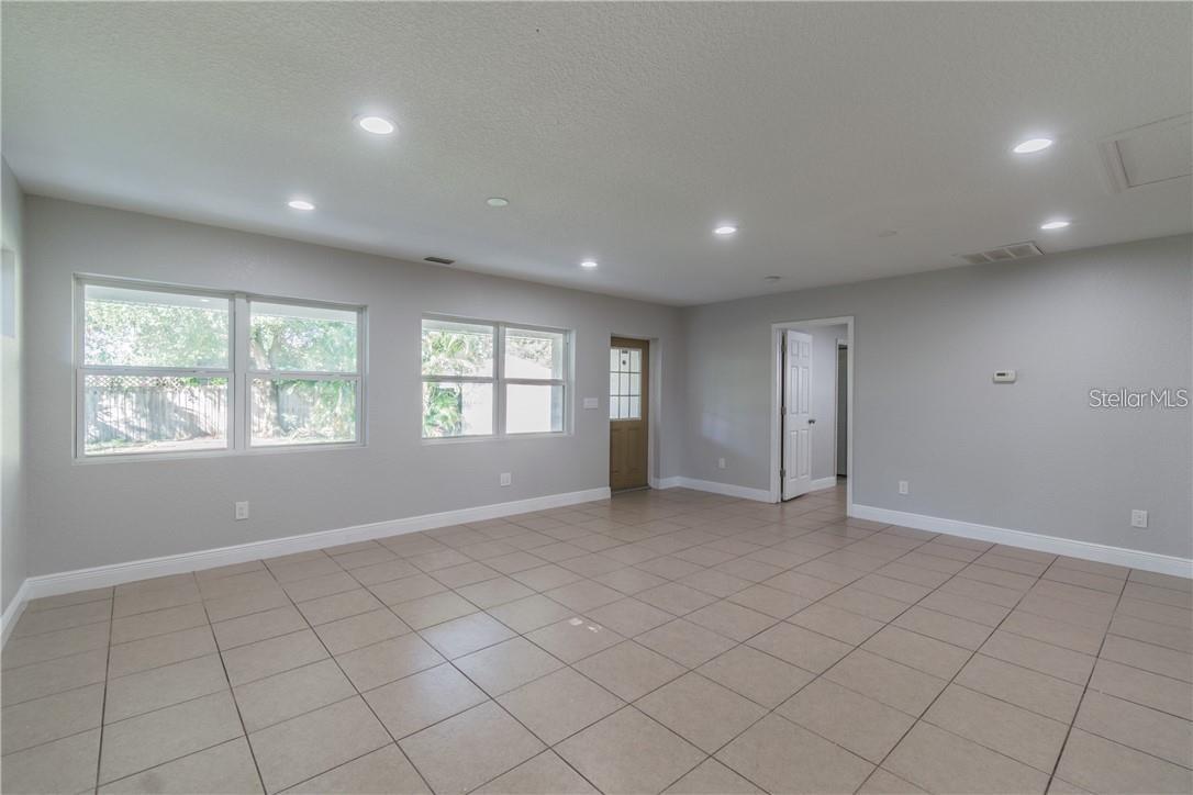 The entrance to the master bedroom is just to the right of the back lanai door. Completely separate from the other bedrooms.