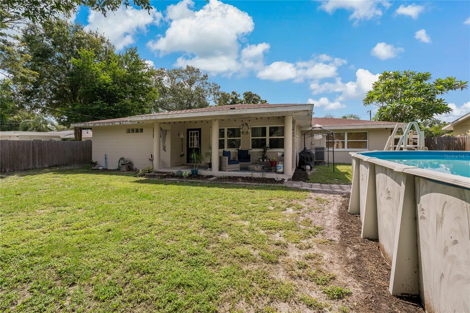 Create a backyard oasis with a wrapped and raised deck around the pool!