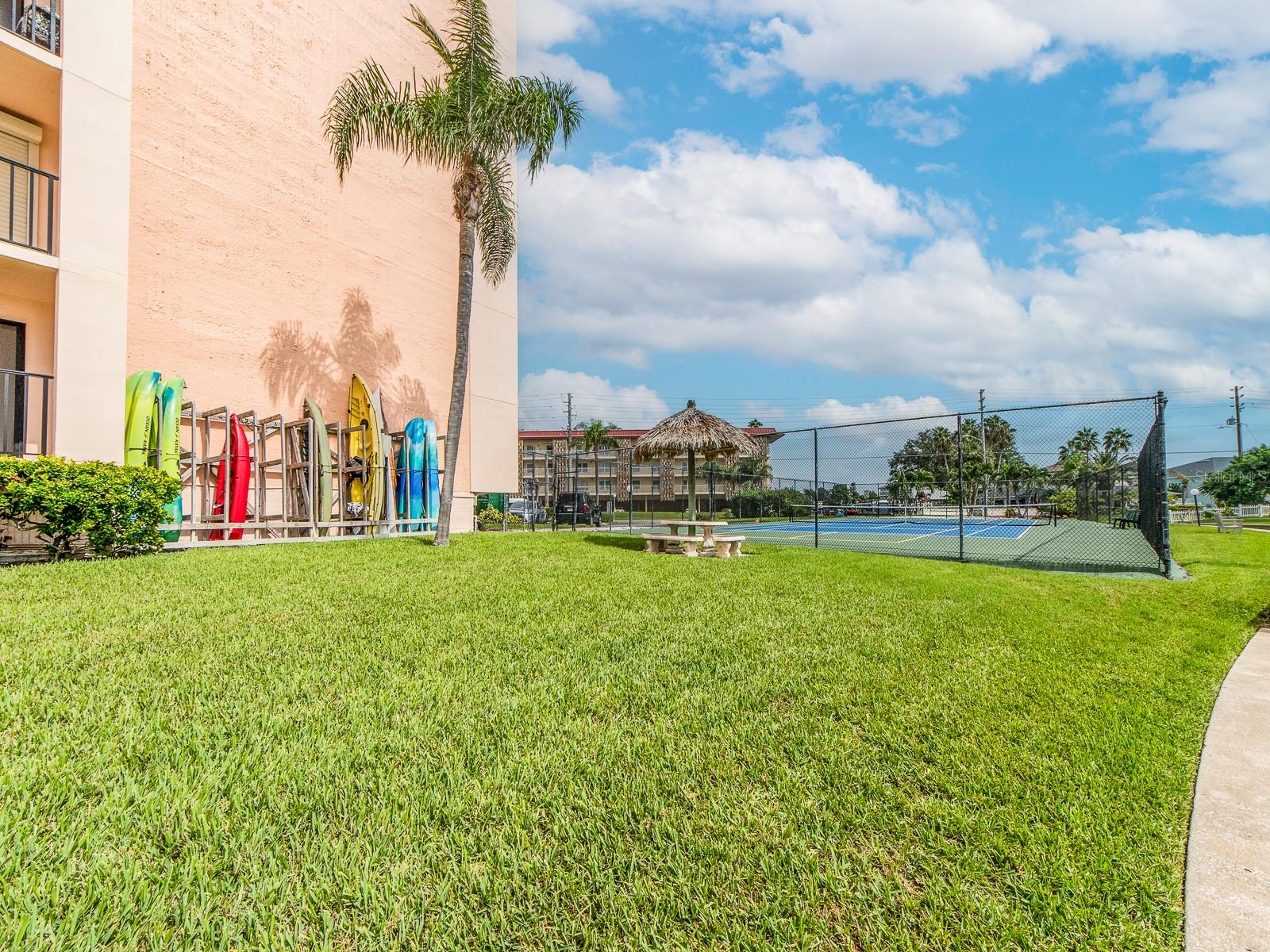 Kayak and paddleboard storage near the tennis courts.