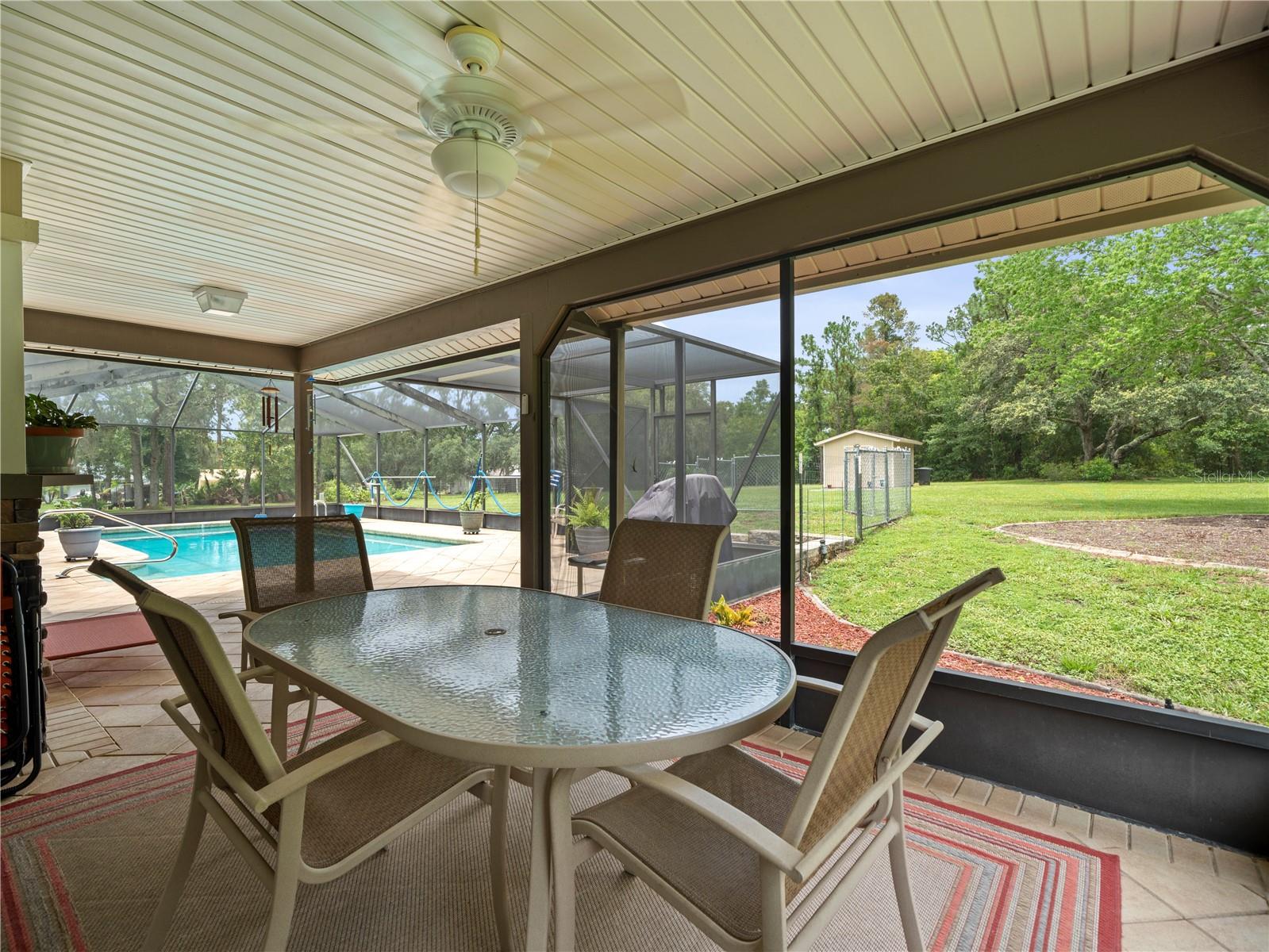 Covered dining area inside the pool area