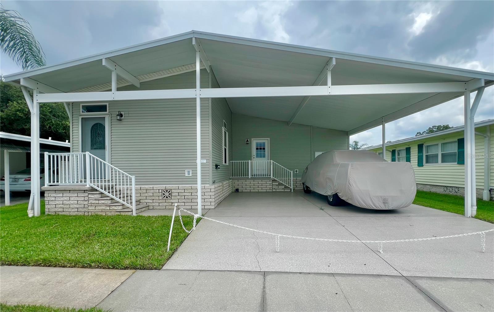 Front of home with side by side parking.