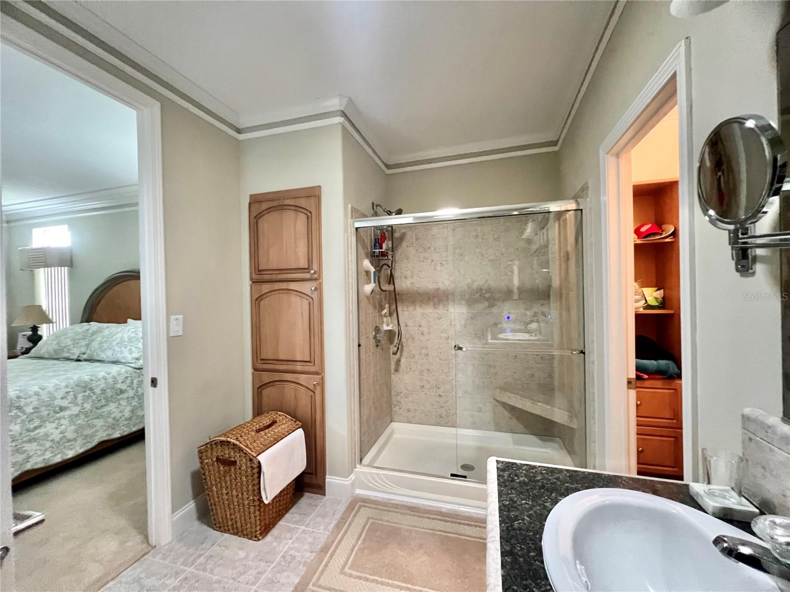 Ensuite bathroom with walk in closet