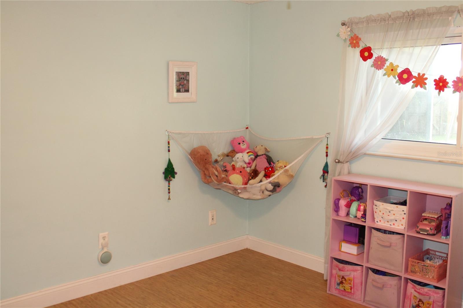 Play room just outside the bedrooms has a walk-in closet.