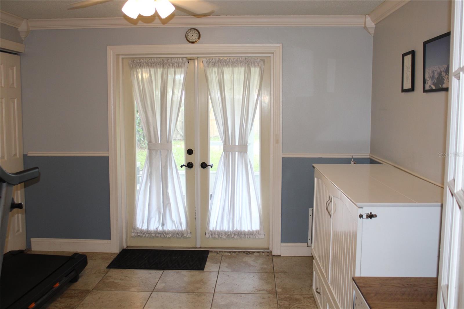 Third bedroom/bonus room has French doors to screened patio.