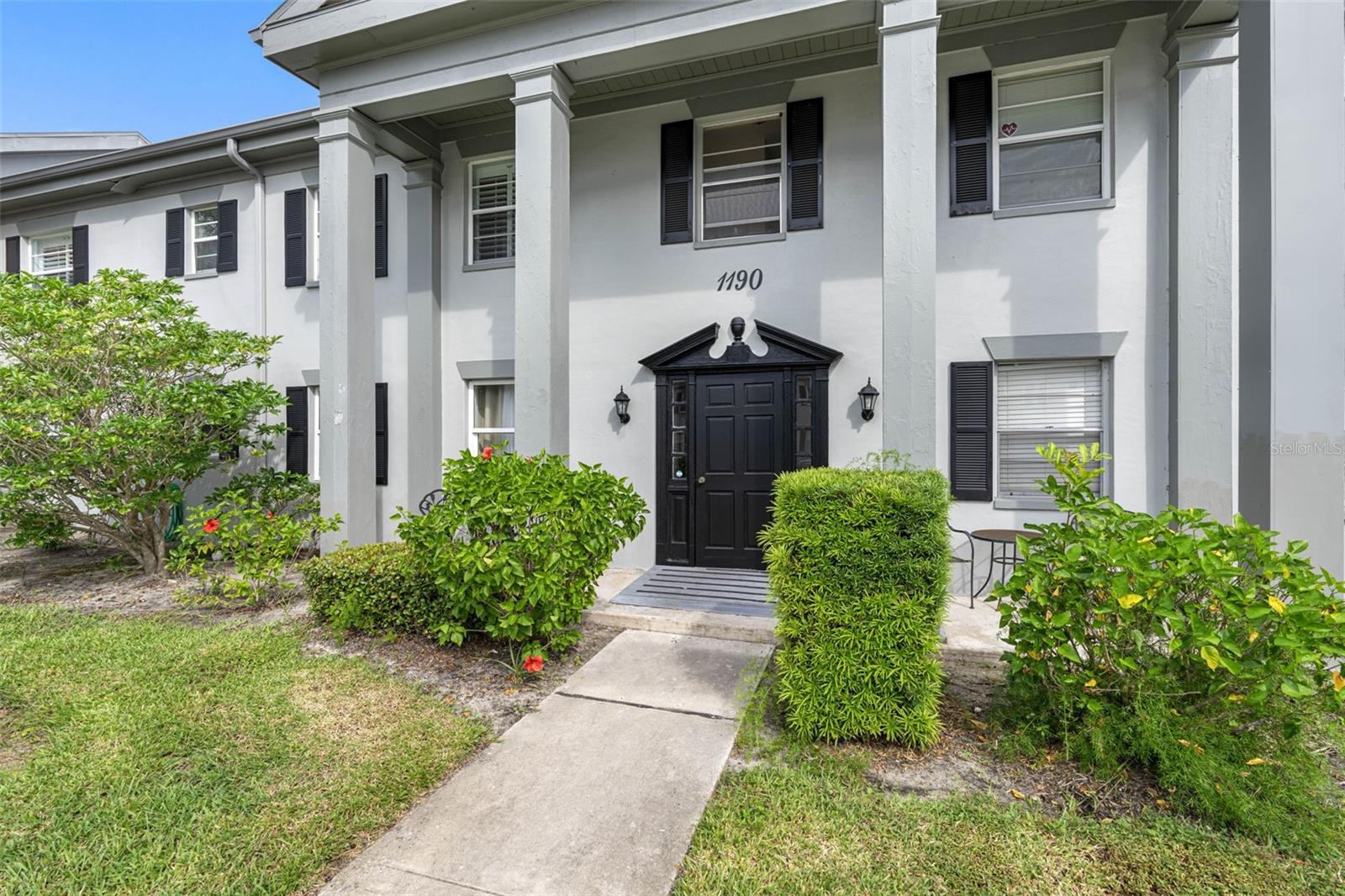 The Les Chateaux condo building in South Pasadena presents a classic and inviting architectural style, characterized by its symmetrical design and elegant details.