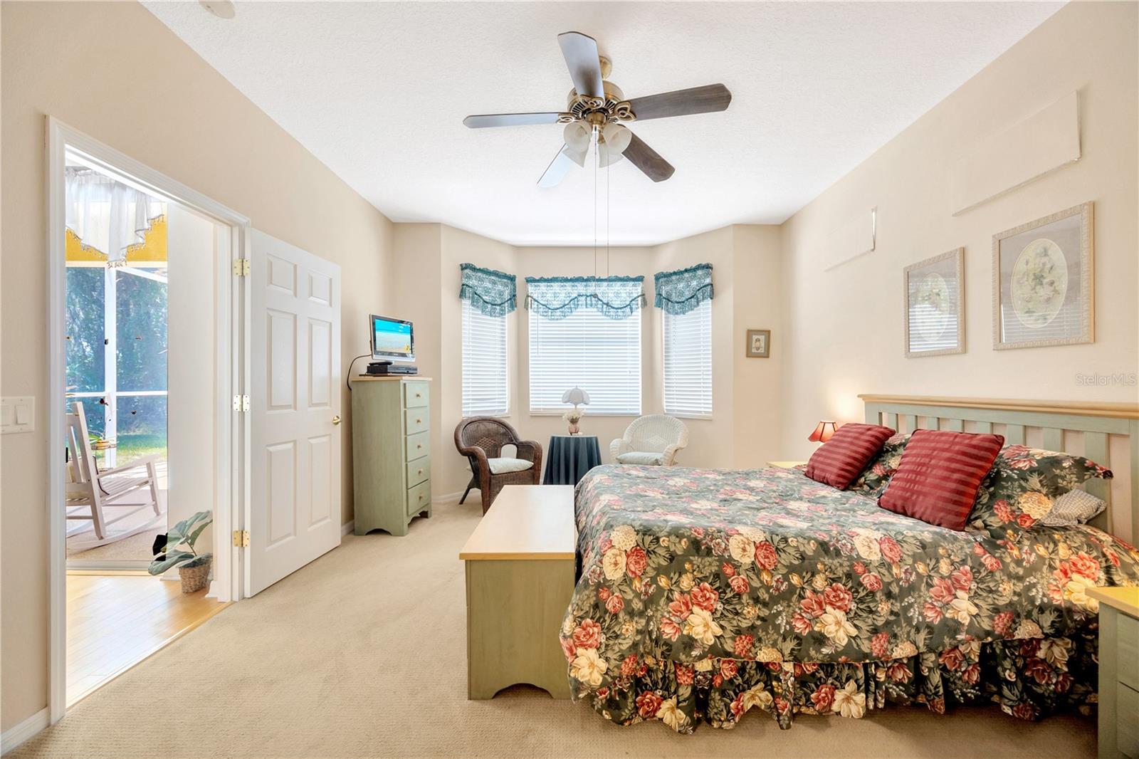 Primary bedroom with views of the private backyard.