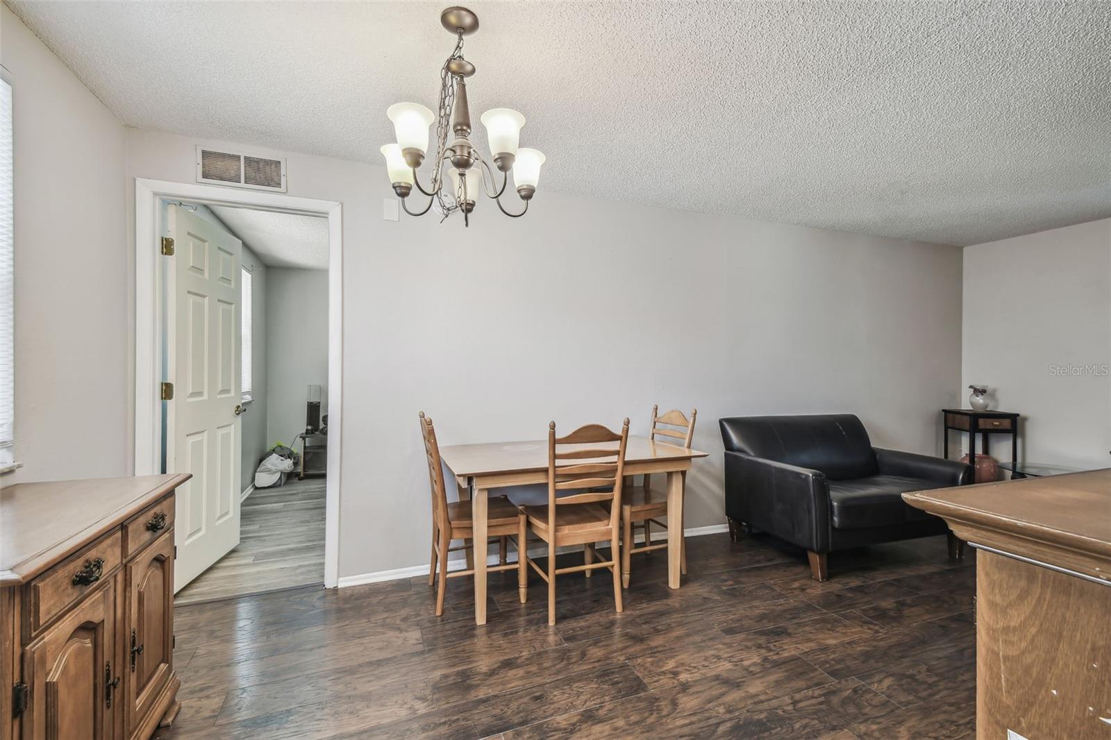 Dining area leads to primary bedroom