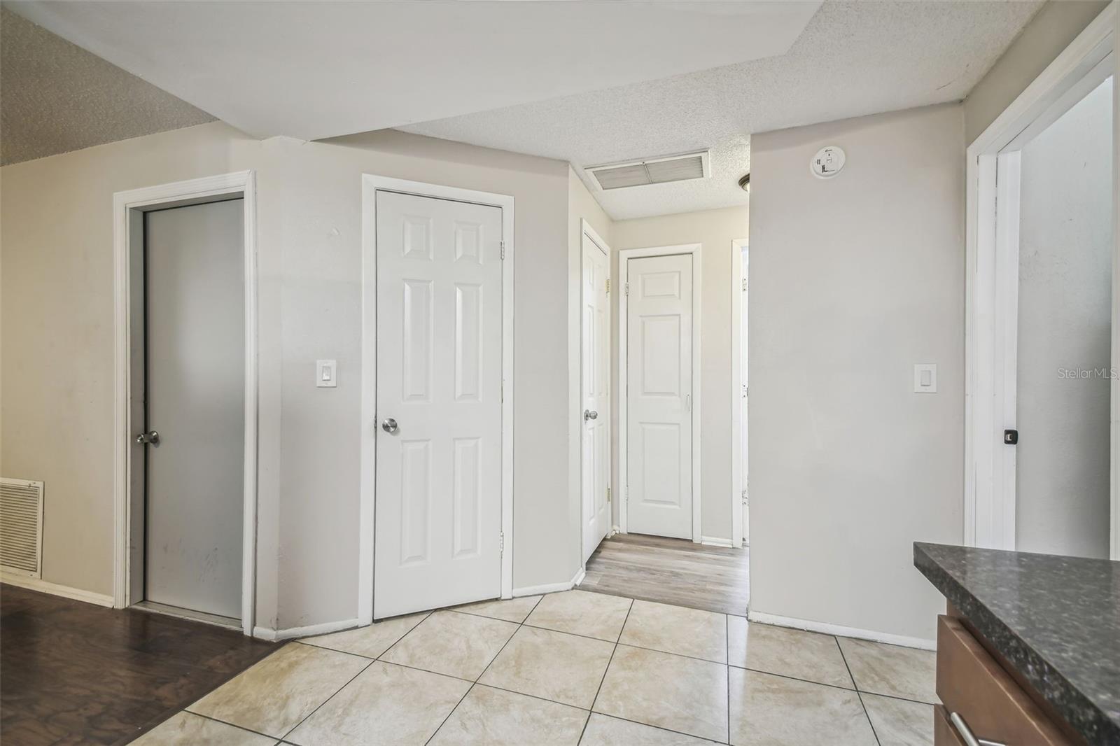 alcove at kitchen leading to bedrooms