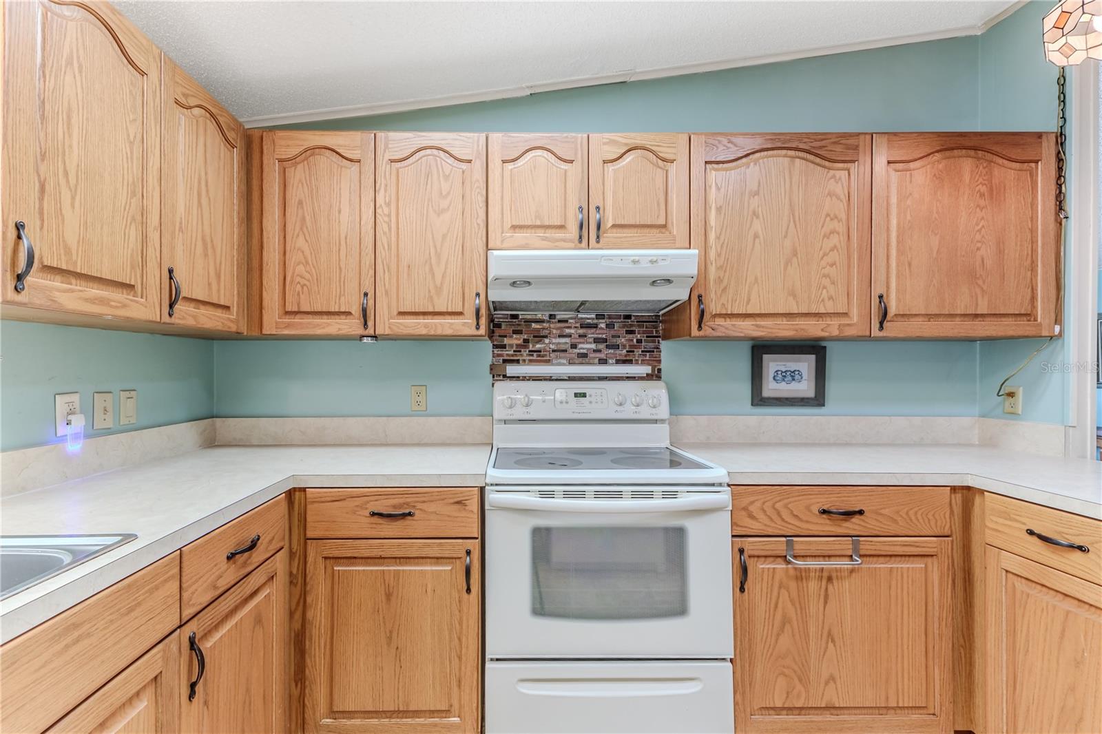 Lots of wood cabinets