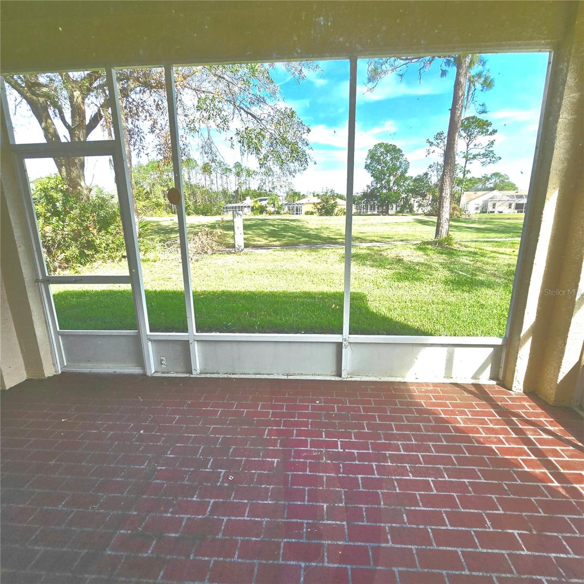 Screened-in patio overlooking golf course