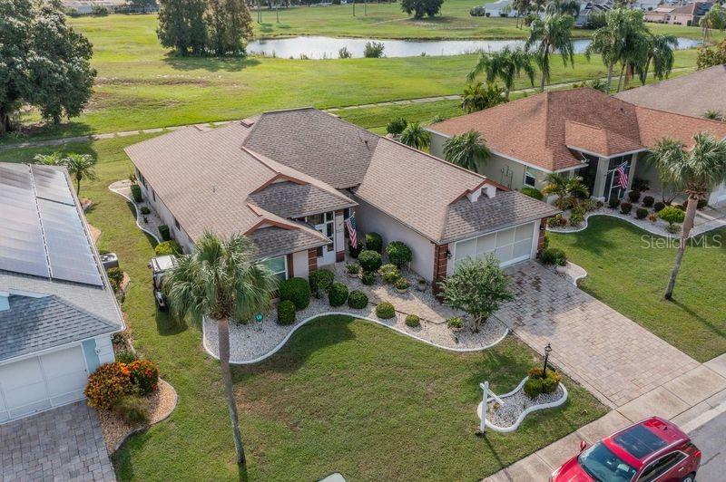 Overhead view of home and pond beyond