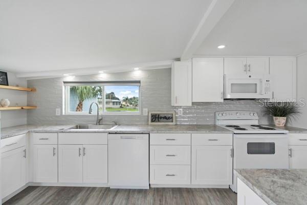 Kitchen w/farmhouse sink and view of the Pond with fountain