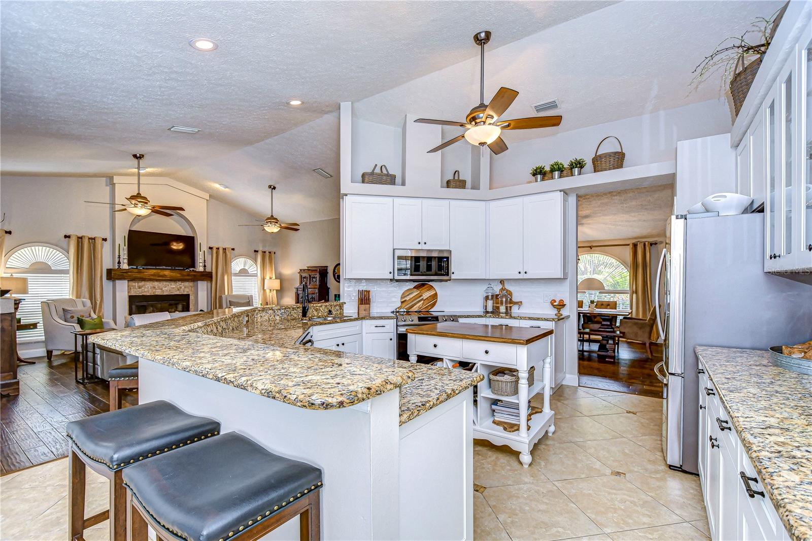 Kitchen with granite counters & desirable white cabinetry!