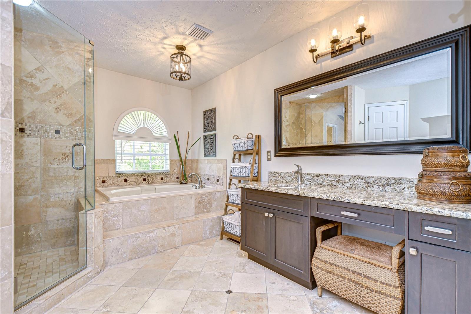 Primary bath with granite counters, seamless shower & garden tub!