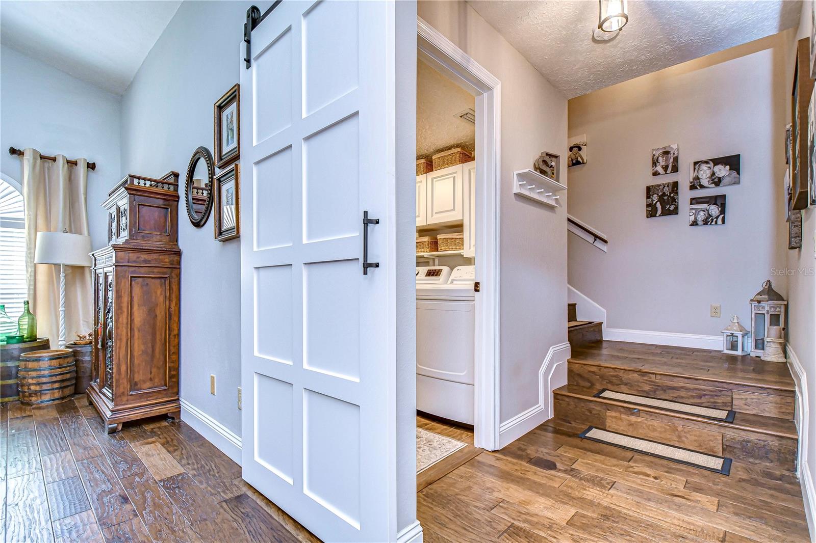 Desirable barn door leads to stairs to the bonus room!