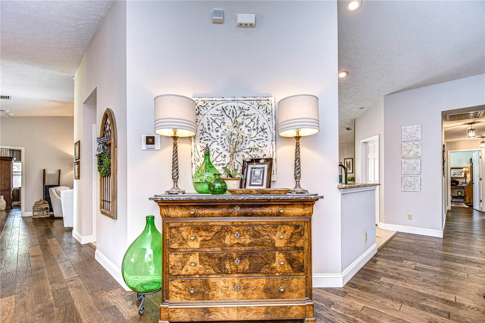 Neutral paint accents the warm wood floors!