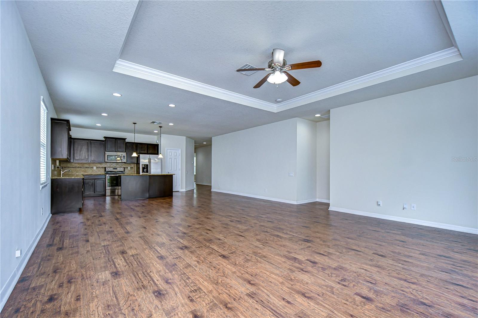 Beautiful tray ceilings and sliders to the patio!