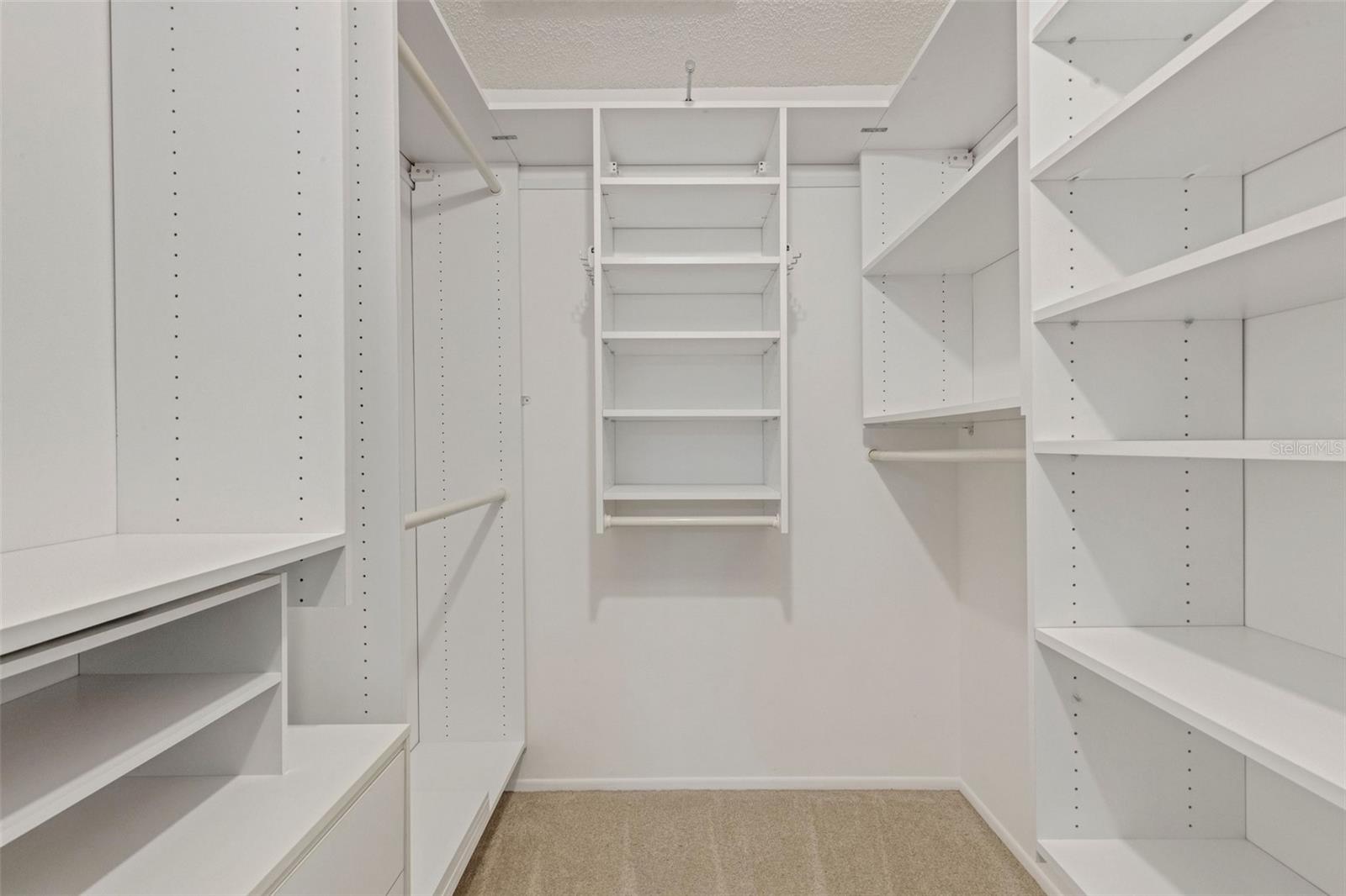 Master closet with updated cabinetry & organization~