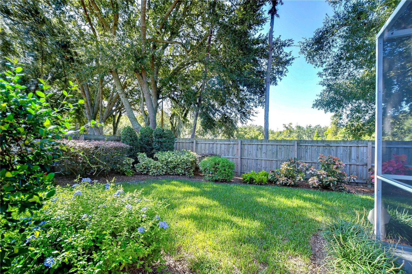 Fenced yard is beautifully landscaped for added privacy and enjoyment!