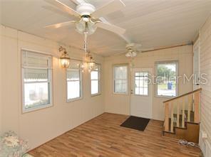 Front extra room with stairs to Kitchen.