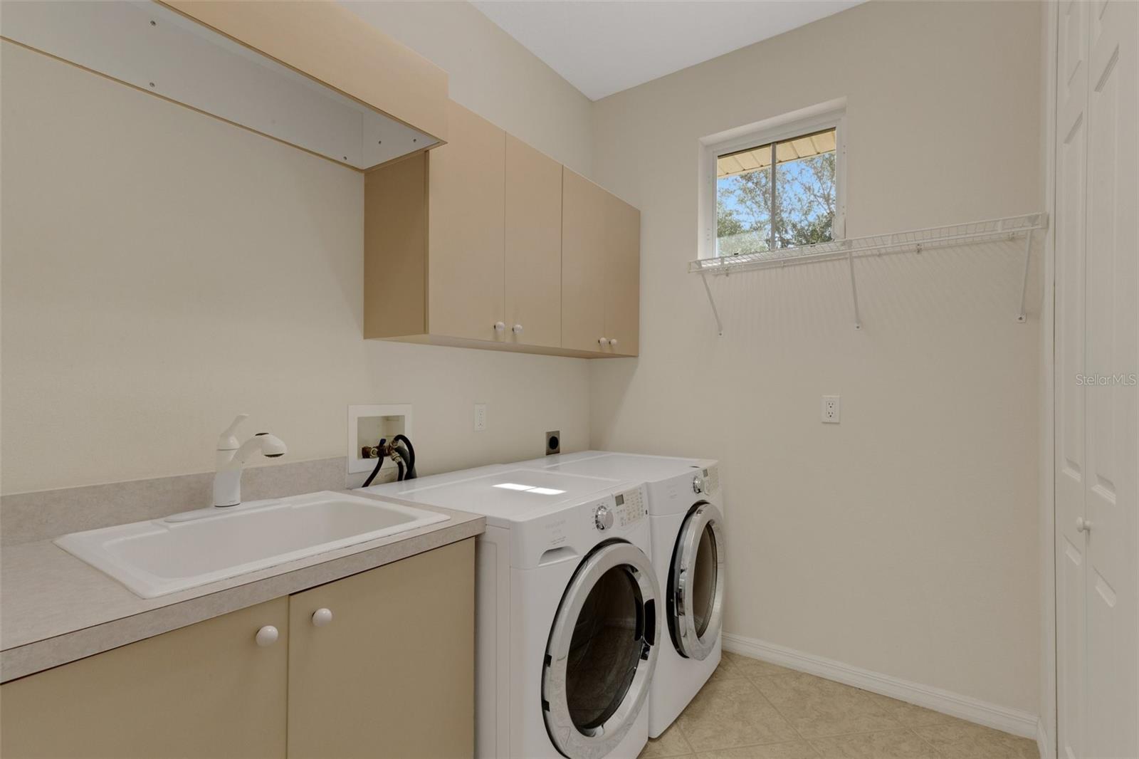 Well-equipped laundry room with enormous walk-in closet!