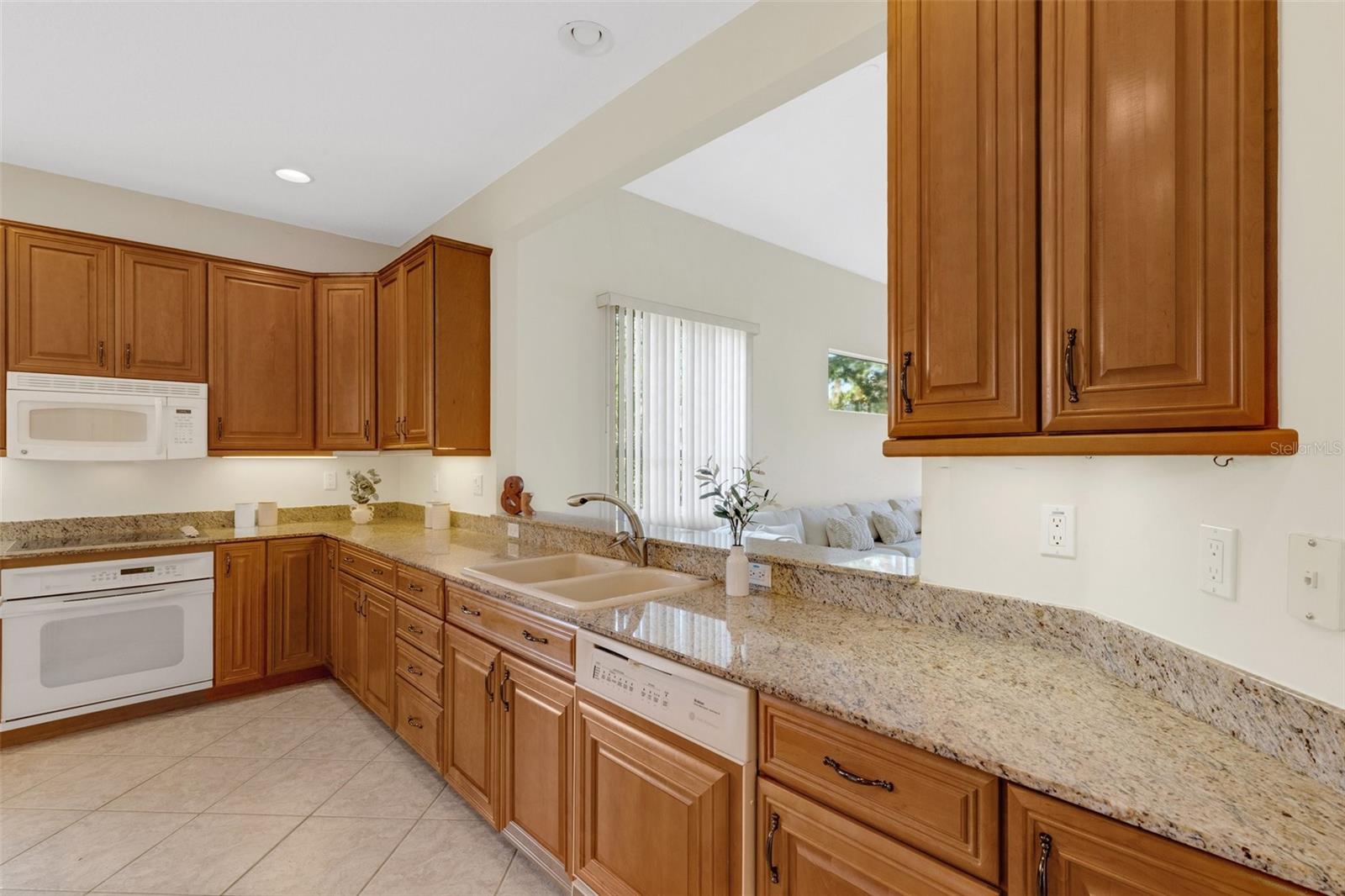 Kitchen has views of the family room and the beautiful pond!