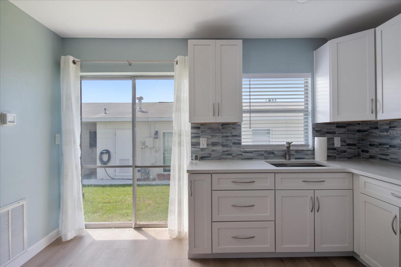 Lots of cabinets with stainless steel sink