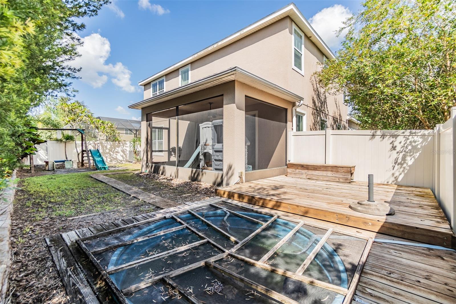 Back yard with former covered pool that can be removed