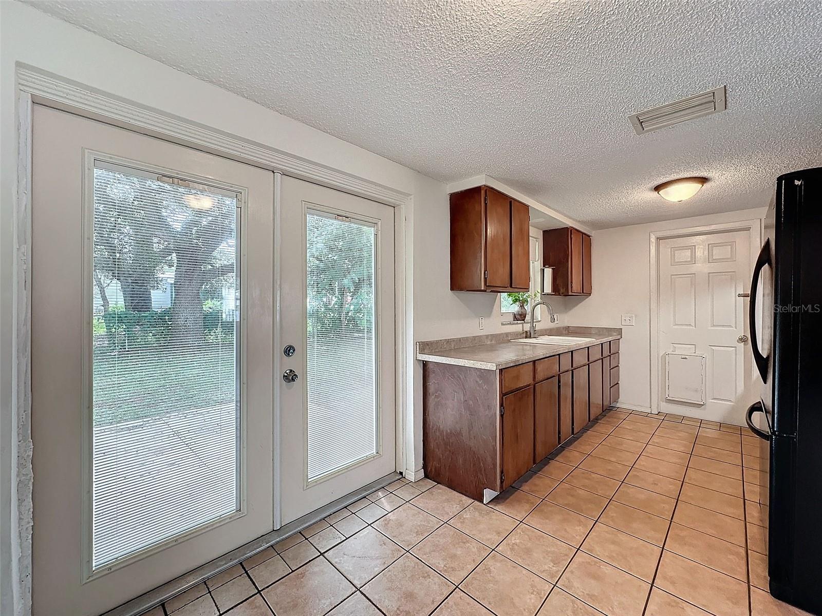 French doors lead out to the open patio