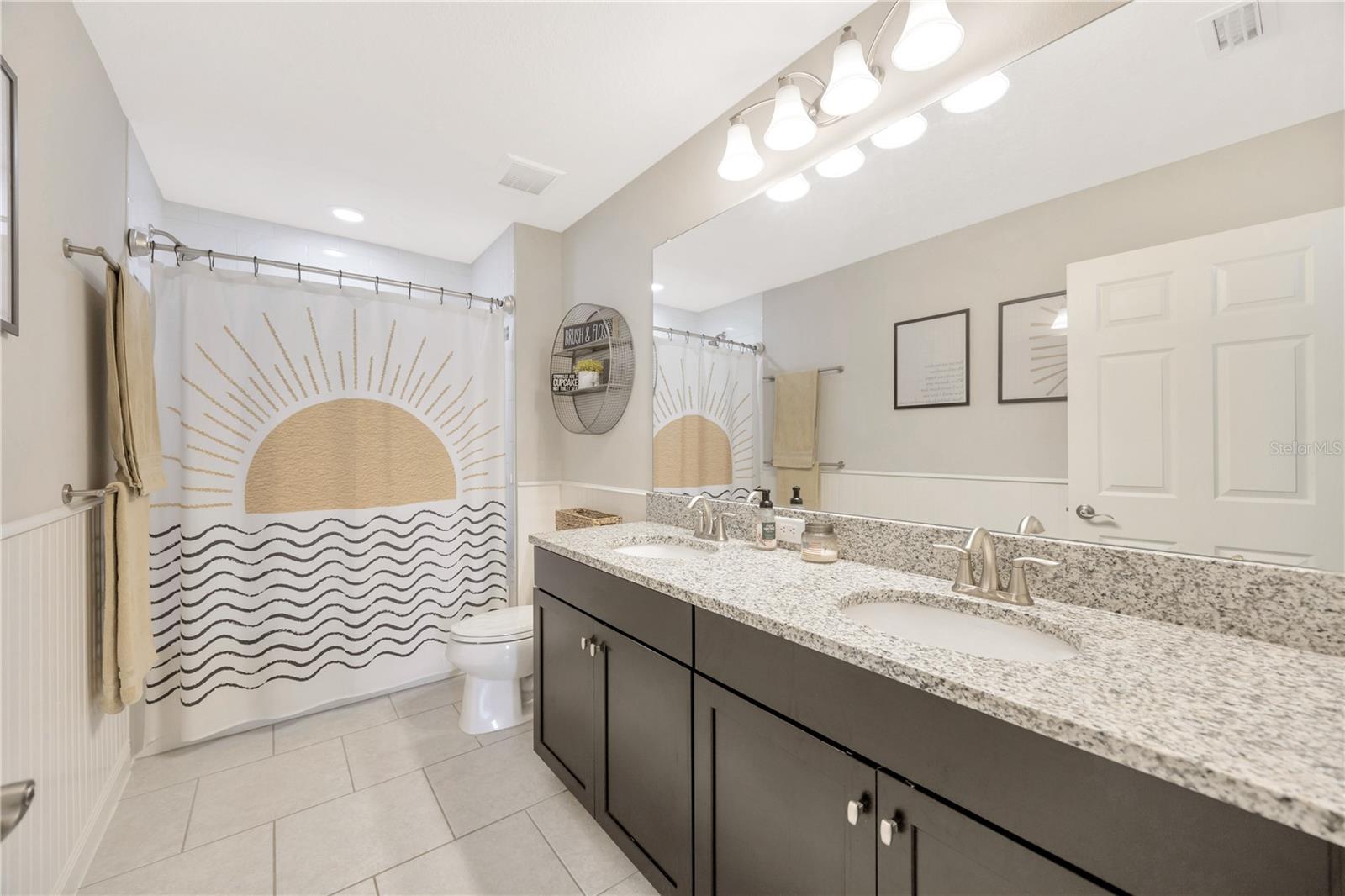 Full bath upstairs, with shower and tub as well as dual sinks