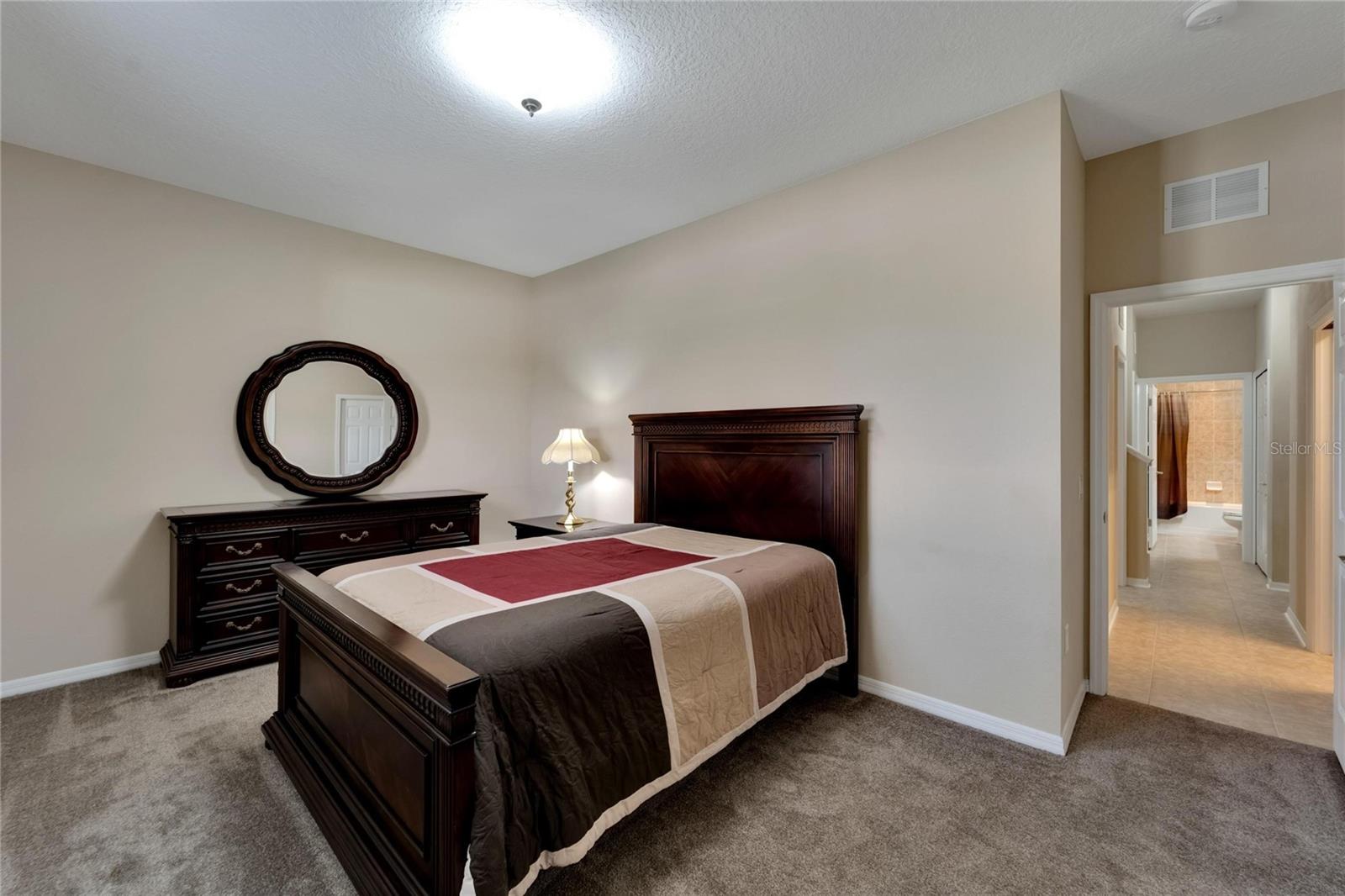 Bedroom 2 with En Suite and access to Screened Patio