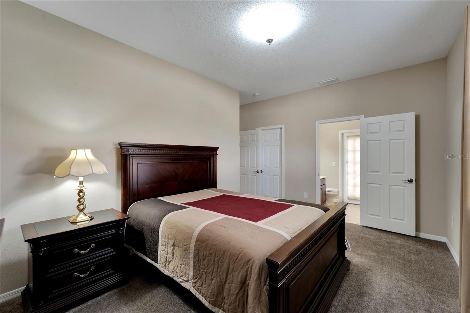 Bedroom 2 with En Suite and access to Screened Patio