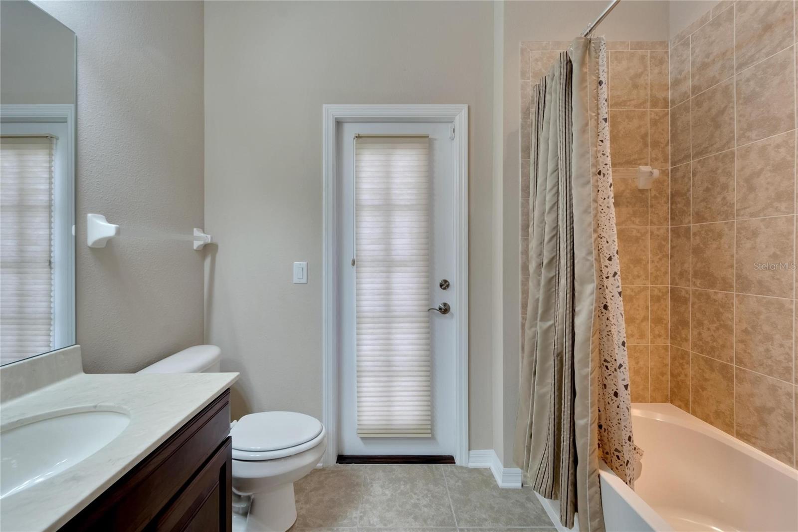 Bathroom 2: En Suite and access to screened patio