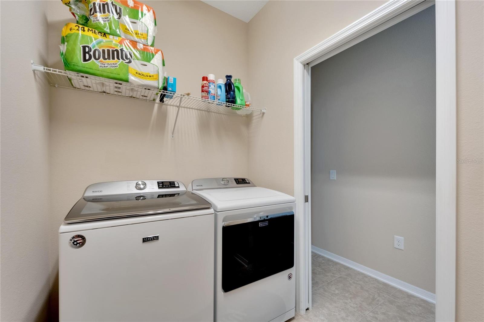 Laundry Room with washer, electric dryer, and utiliy tub