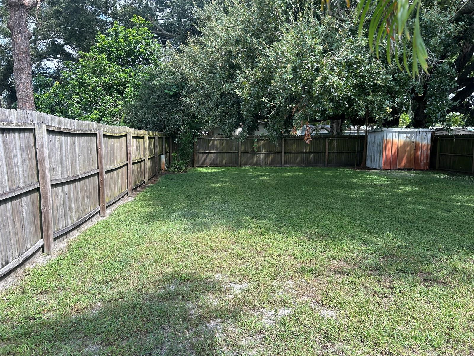 completely fenced back yard