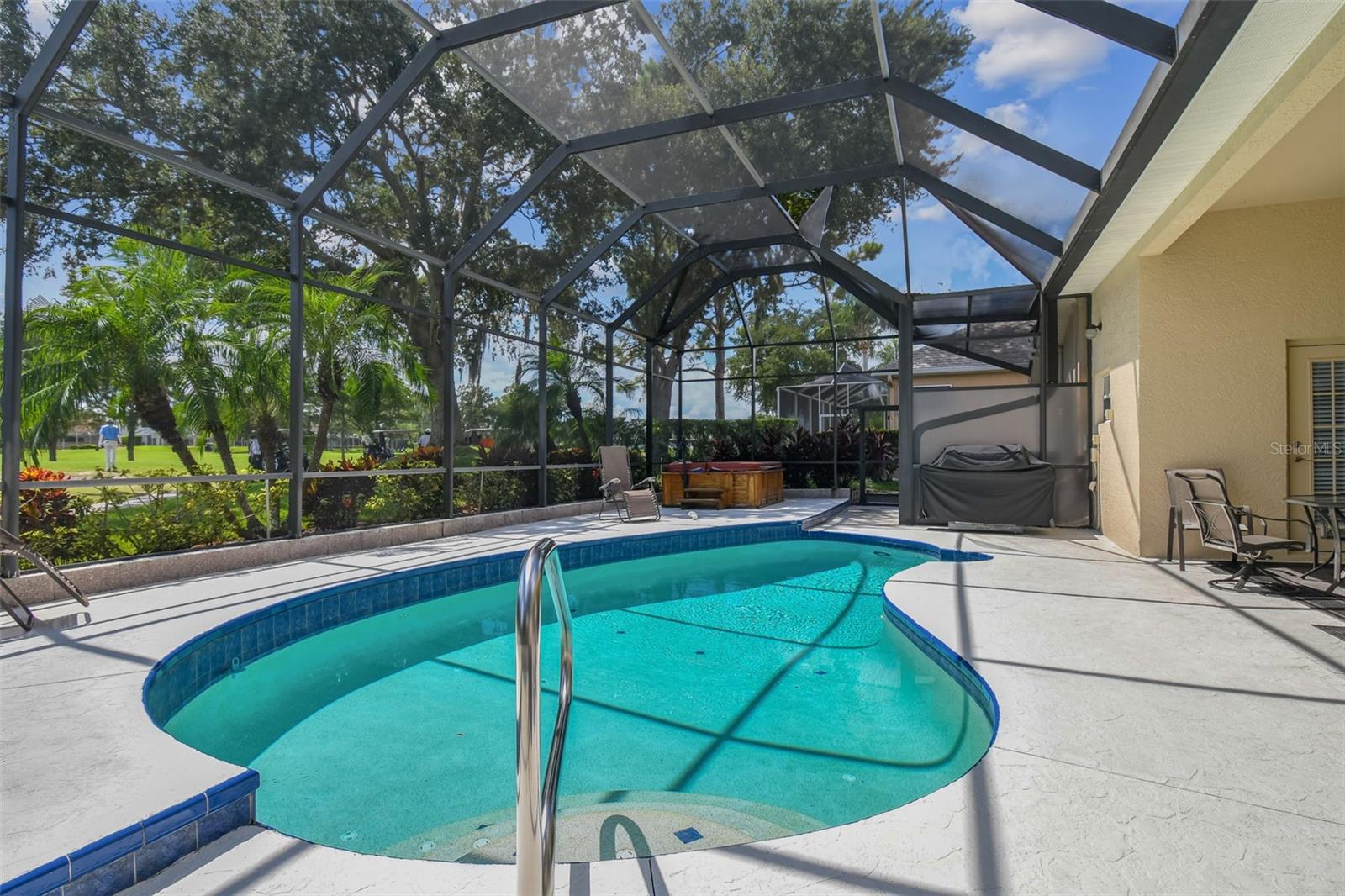 The inviting pool area creates a tranquil oasis with breathtaking golf course vistas~