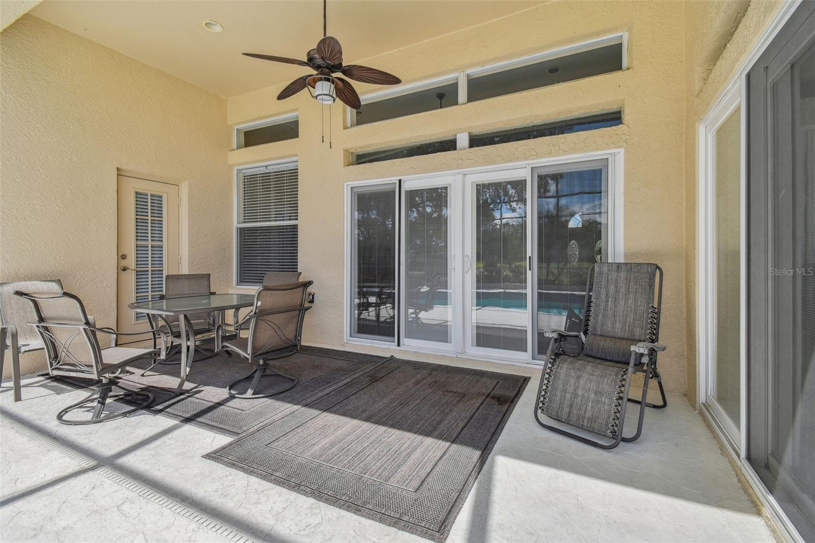 Shaded lanai offers a cool retreat by the pool~