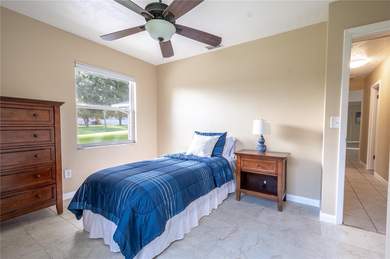 Bedroom 2 features ceramic tile flooring and a built-in closet.