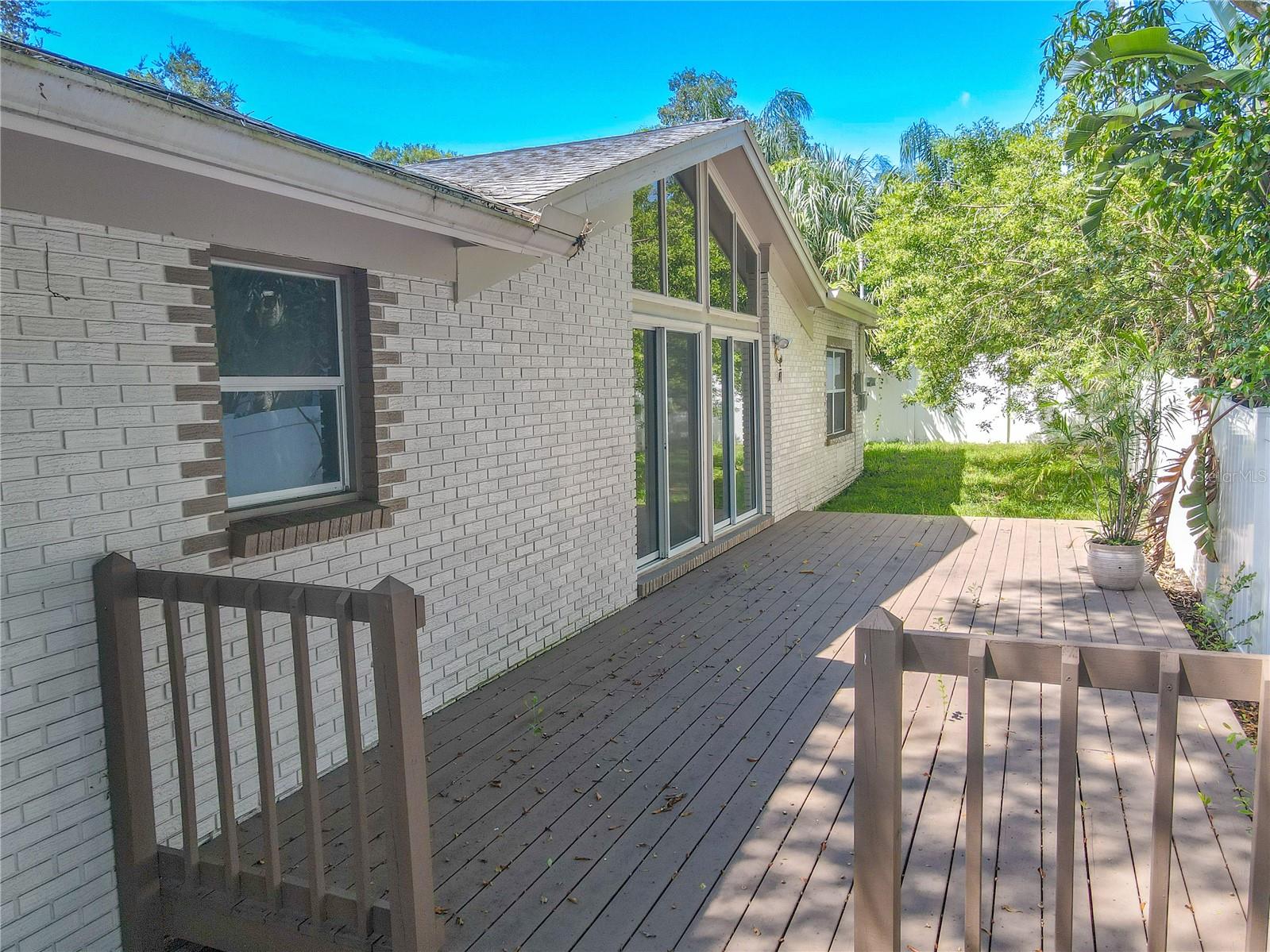 The backyard features a deck.