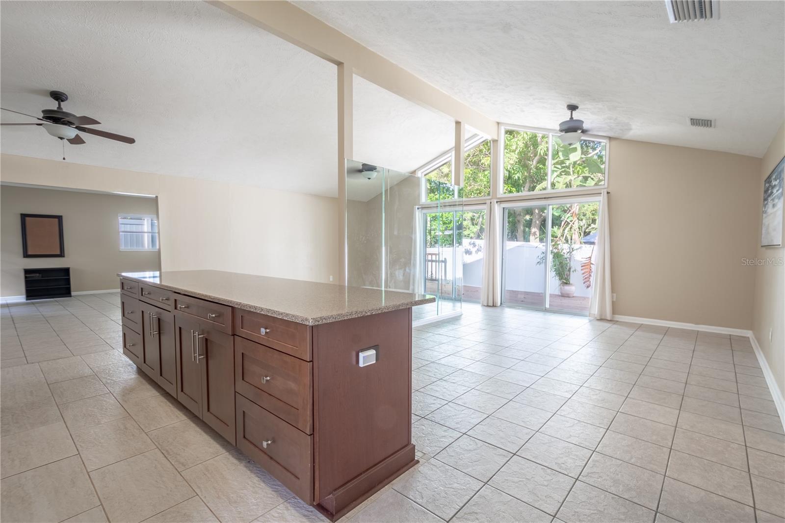 Open floor plan with vaulted ceilings and sliding glass doors and Clerestory Windows, bringing in plenty of natural light.