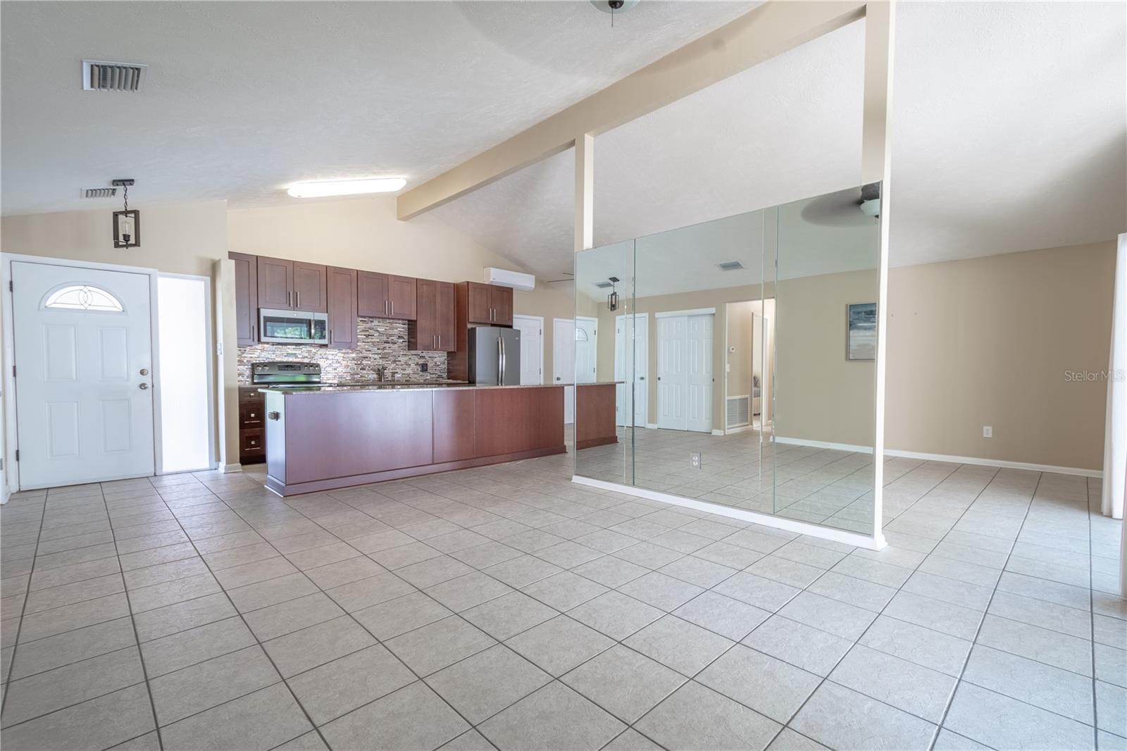 The kitchen is open to the living and dining rooms.