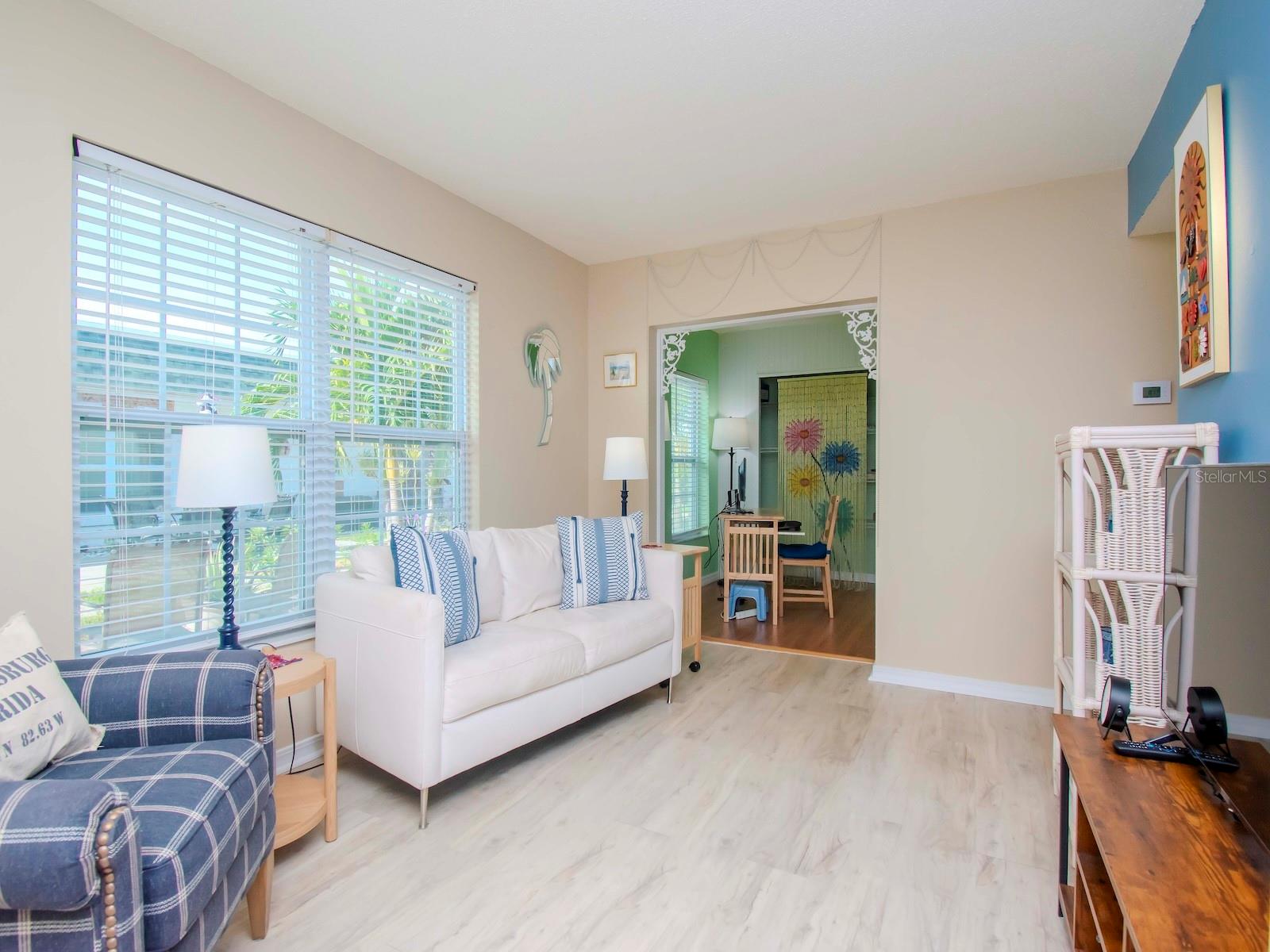 Living room with entry to bonus room