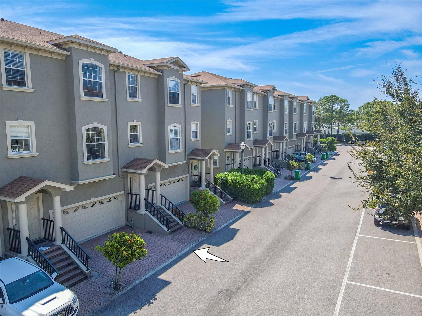 Step into this spacious 3-bedroom townhome, offering 2 full baths, 2 half baths, and a 2-car garage. With 2,400 sq. ft. of living space, you'll enjoy two inviting balconies and a cozy covered patio—perfect for quiet mornings or evening gatherings. Tucked away in the sought-after gated community of Bayou Grande, this home is your gateway to comfort and style.